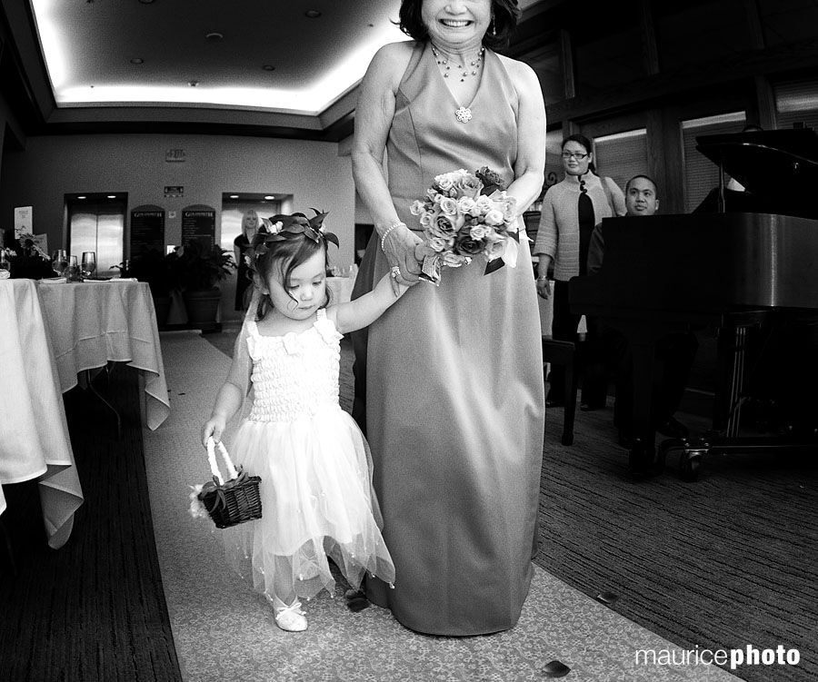 Mother of the Bride and Flower Girl walking down the aisle