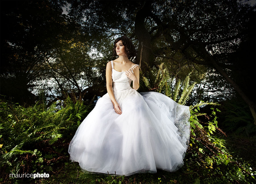A fashion picture of a bride in the woods, lit with off camera flashes, including an alien bee vagabond, and Canon 580ex II. Trash the Dress session. Fashion Photography in Seattle by Maurice Photo