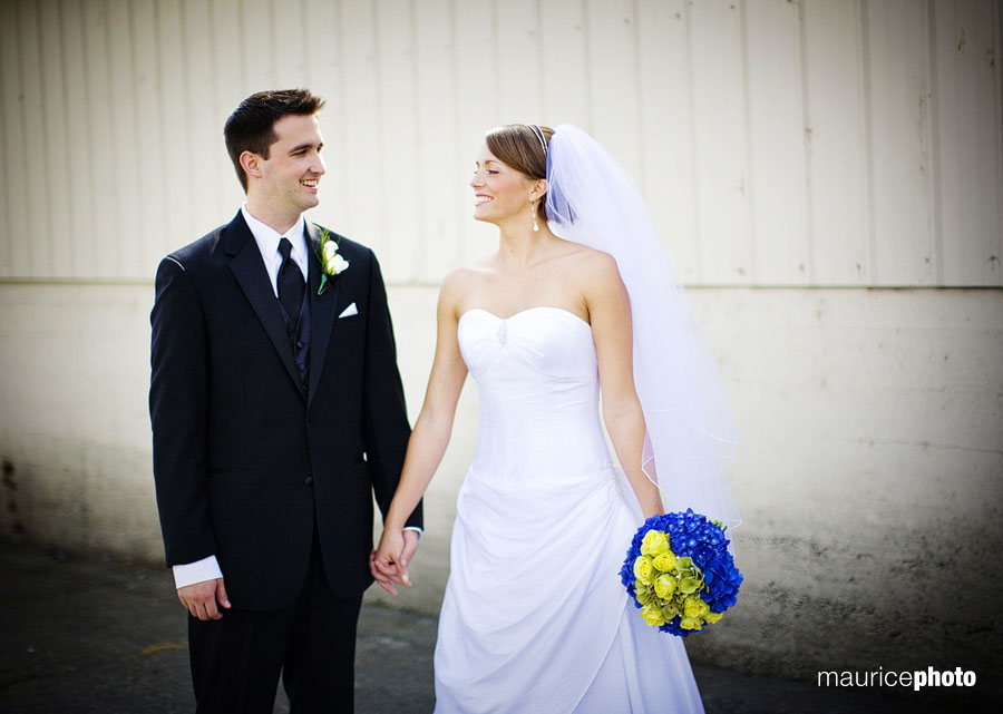 Portraits of a bride and groom in front of a barn at Lord Hill Farms in Snohomish