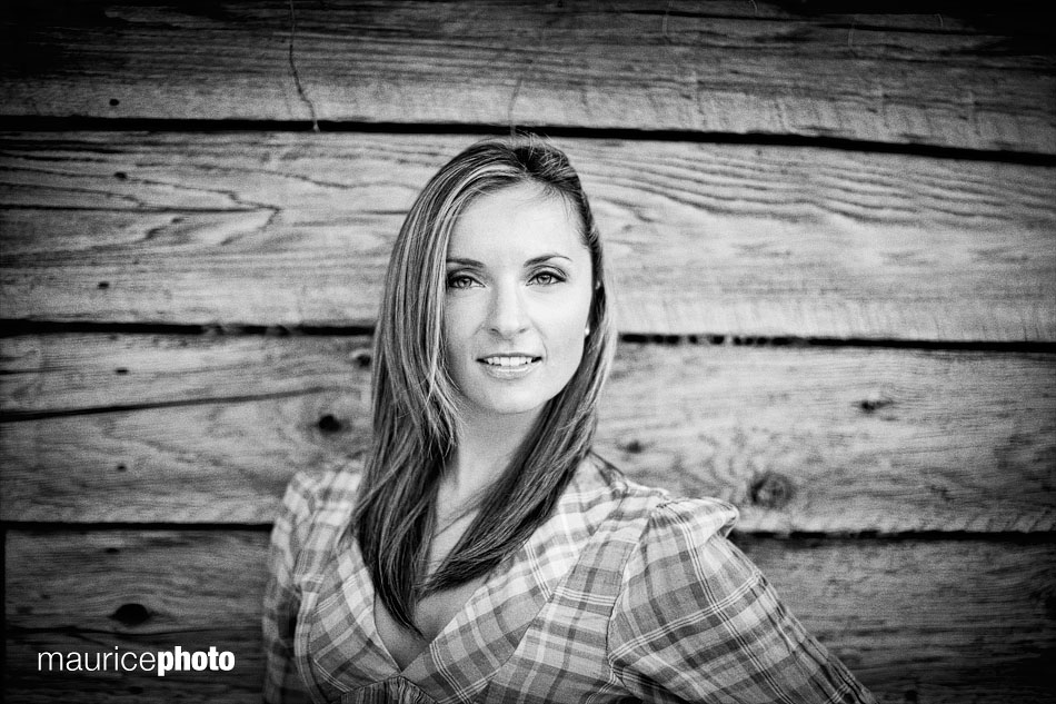 a black and white portrait against a wood wall in Seattle