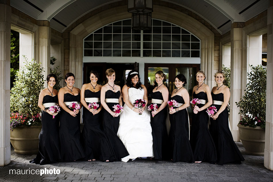 A picture of a bride and bridesmaids posing at Newcastle. 