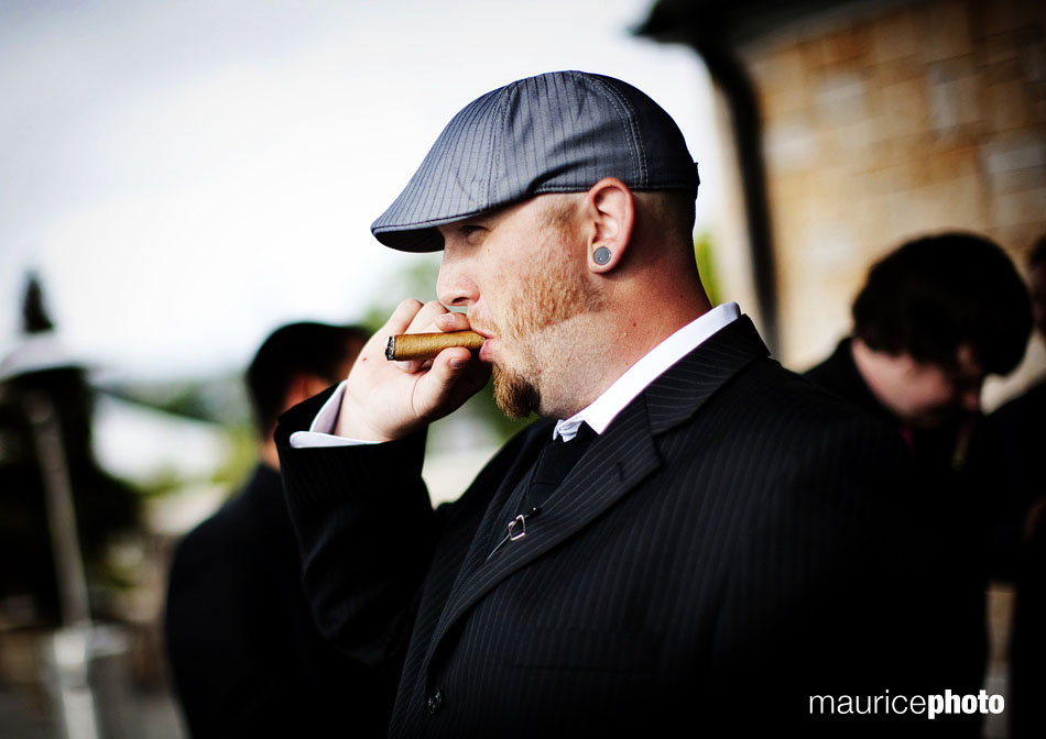 Wedding officiant smoking a cigar