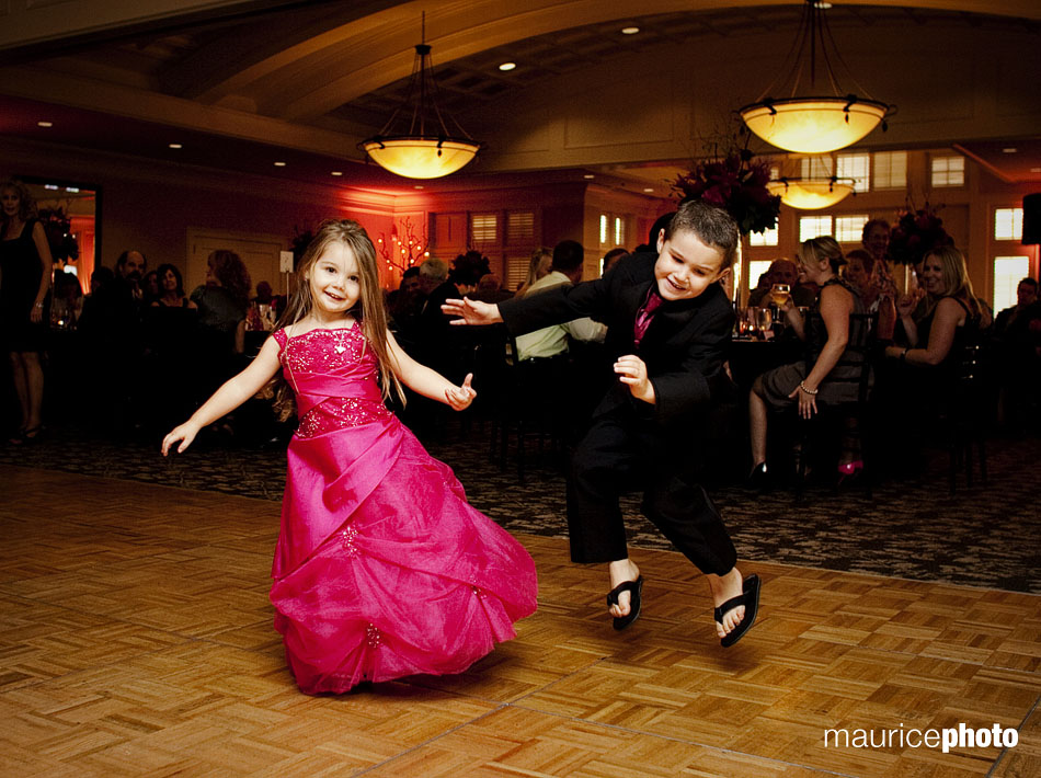 Pictures of the ring bearer and flower girl dancing at the reception.