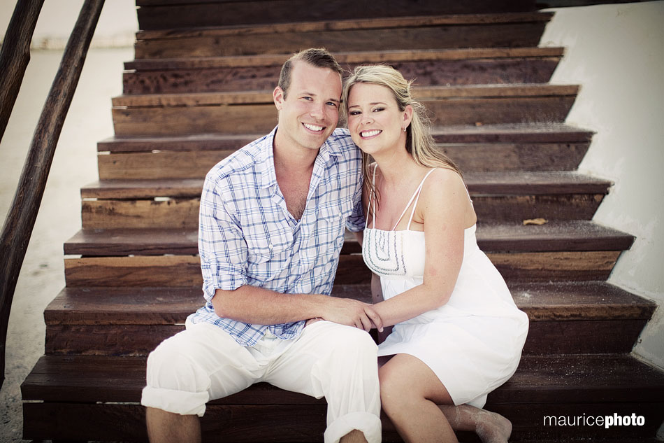 A bride and groom pose on the beach before their wedding at the Beach Palace Resort. 