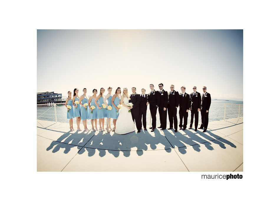 Photos of a wedding party on Elliott Bay in Seattle. Bright Sun wedding pictures.