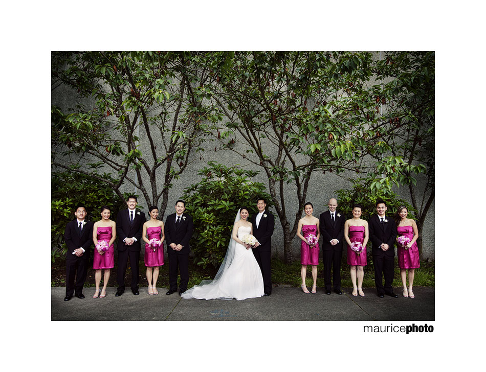 Photo of a bridal party posing outside the Parish of Saint Louise in Bellevue