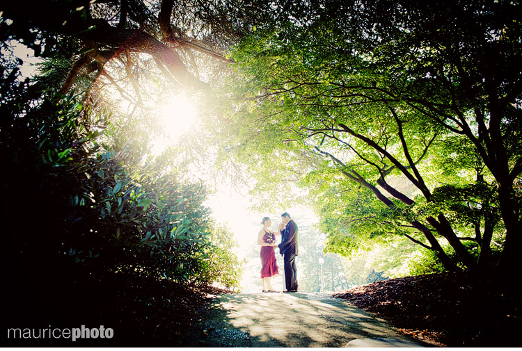 A bride and groom pose for pictures next to the Asian Art Museum in Seattle.