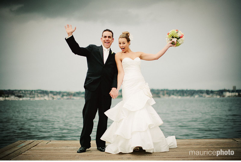 A bride and groom pose for wedding pictures on Lake Union at the Center for Wooden Boats in Seattle. 