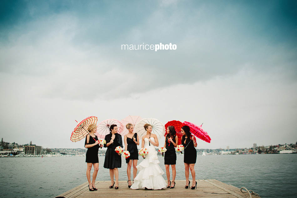 Bride and bridesmaids pose for wedding pictures on Lake Union in Seattle. 