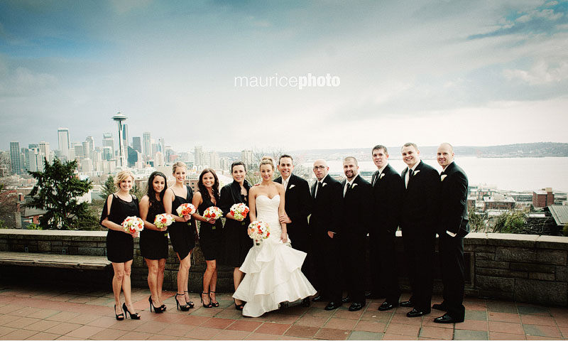 wedding party pictures in front of the Seattle Skyline