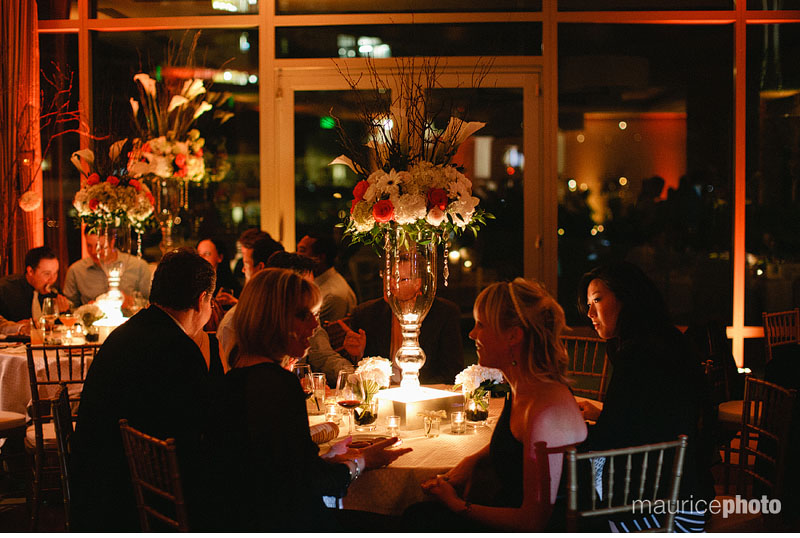 Centerpieces and candles decorate the tables at a Pan Pacific Wedding reception