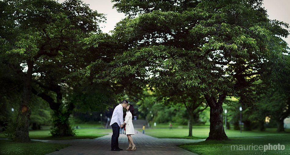 a couple pose for portraits in the uw campus