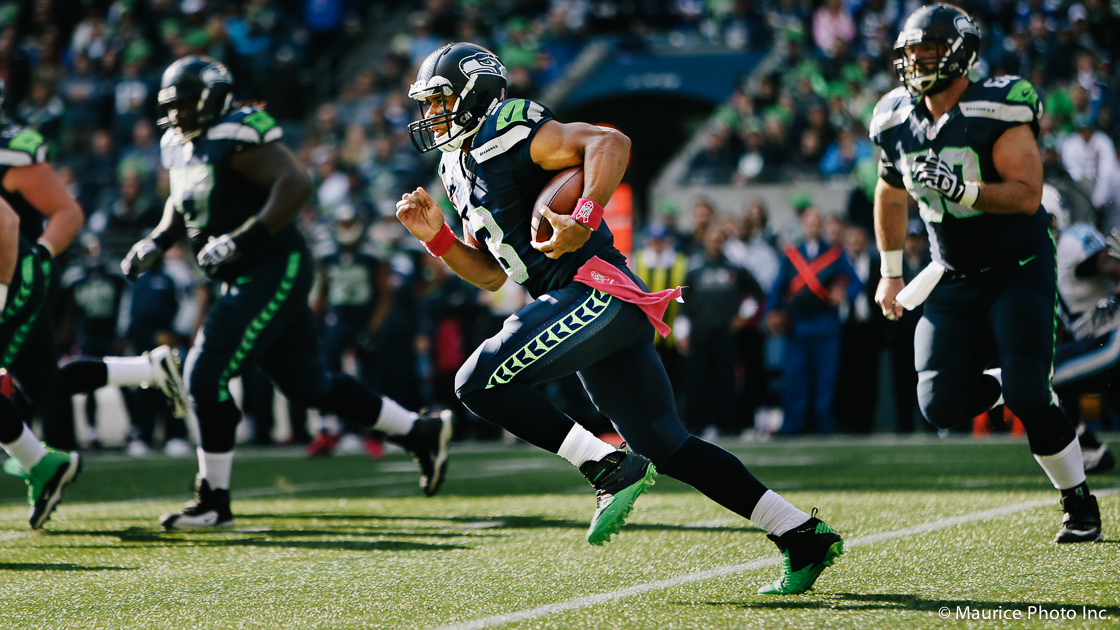 Russell Wilson scrambles against the Titans