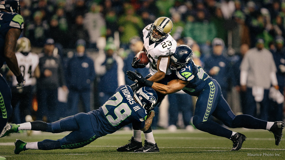 Gang tackle by the Seahawks Defense