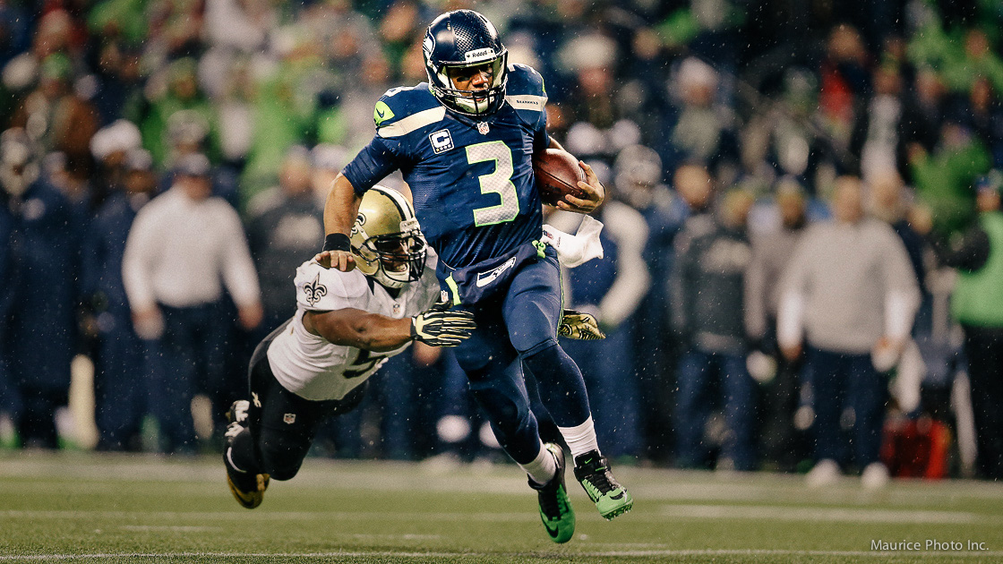 Russell Wilson runs the ball against the Saints