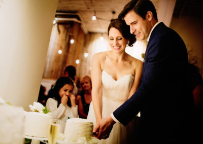Bride and groom cut their cake at Sole Repair