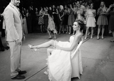 Groom removes garter belt at Jardin Del Sol Wedding.