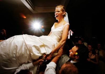 Bride lifted up during horah dance.
