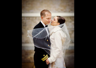 Bride and groom in military uniform